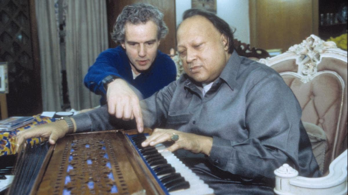 Michael Brook and Nusrat Fateh Ali Khan performing together (Photo: Real Worlds Records)